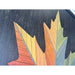 Close-up of the Autumn Maple Leaf wall art highlighting the gradient transition of yellow, orange, and green tones with fine geometric wood detailing.